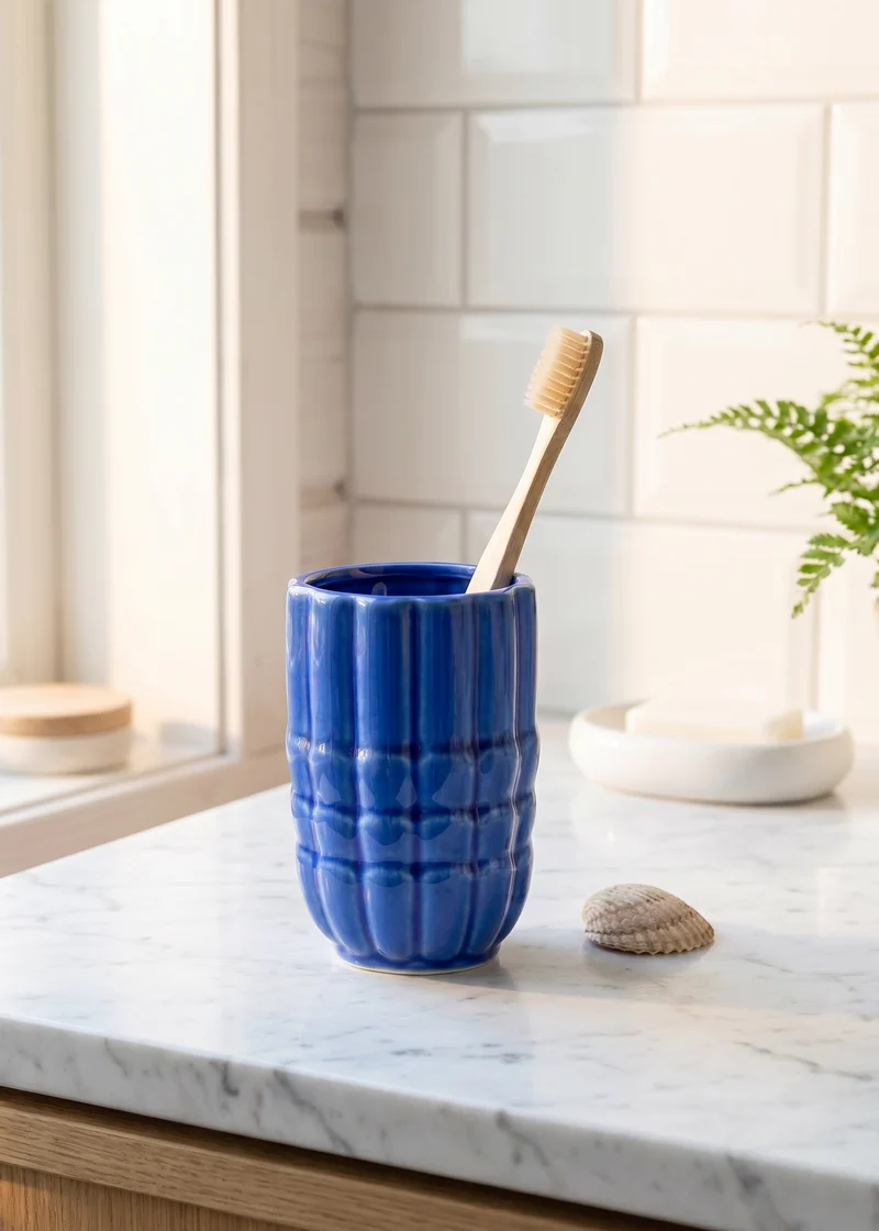 Blue ceramic seashell toothbrush holder