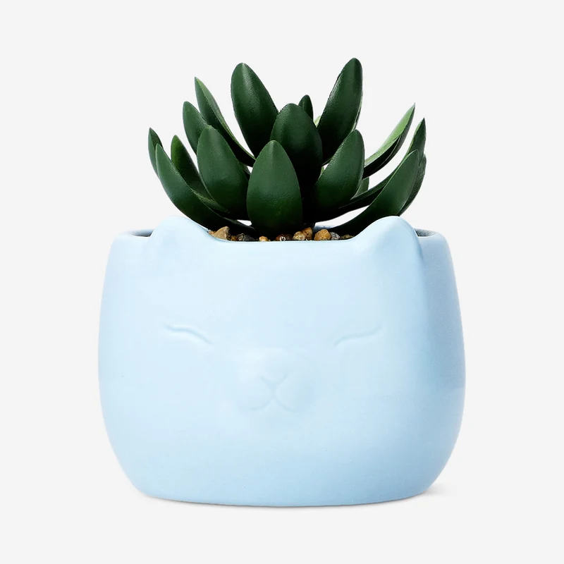 Faux succulent in blue ceramic pot